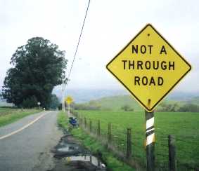 Signs at the base of Sonoma Mountain Road, close up